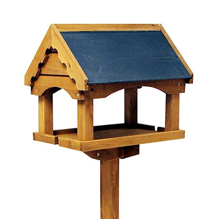 Wooden bird table with high eaves